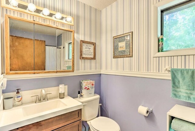 34 Clover Ln, Murphy, NC 28906 - full bathroom featuring wallpapered walls and vanity