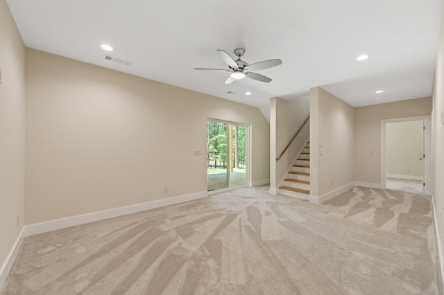 unfurnished room with ceiling fan and light colored carpet