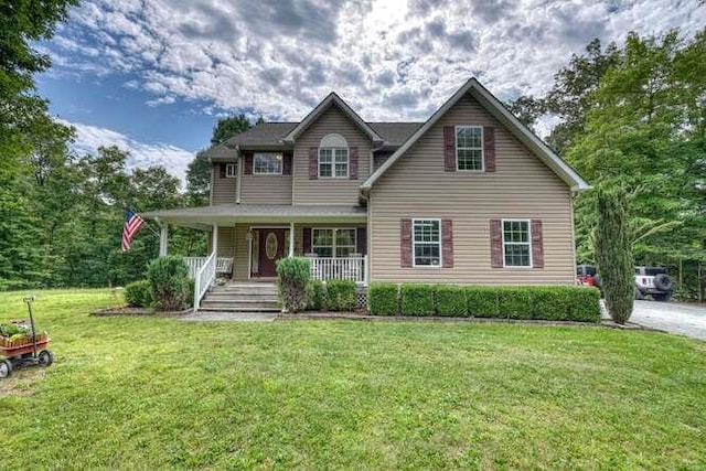 view of front facade featuring a front lawn and a porch