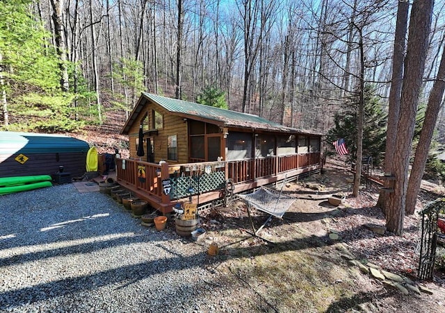 view of front facade featuring a sunroom