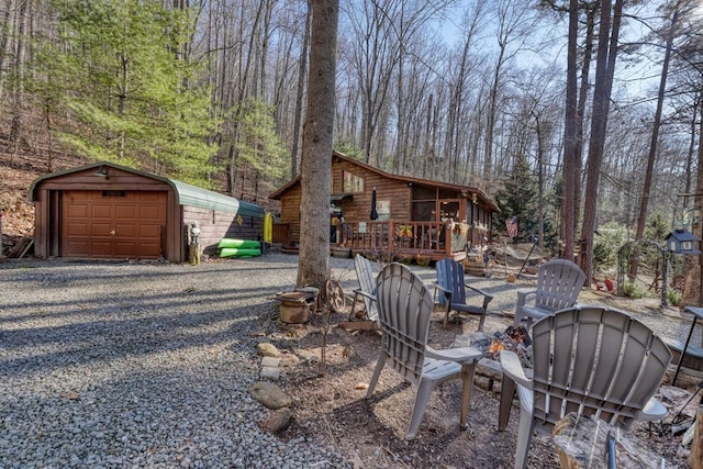 view of patio with a garage and an outdoor structure