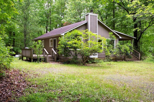 249 Chatuge Woods Dr, Hayesville, NC 28904 - back of house with a chimney, a wooden deck, and a forest view