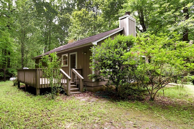 249 Chatuge Woods Dr, Hayesville, NC 28904 - rear view of property with a chimney, a wooden deck, a wooded view, and board and batten siding