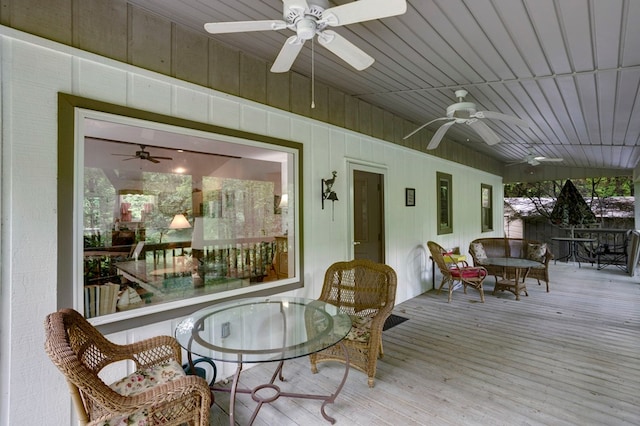 249 Chatuge Woods Dr, Hayesville, NC 28904 - sunroom / solarium with ceiling fan, outdoor dining area, a wooden deck, and wood finished floors