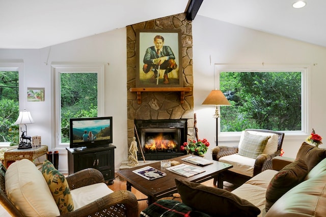 249 Chatuge Woods Dr, Hayesville, NC 28904 - living area featuring vaulted ceiling, a stone fireplace, healthy amount of natural light, and wood finished floors
