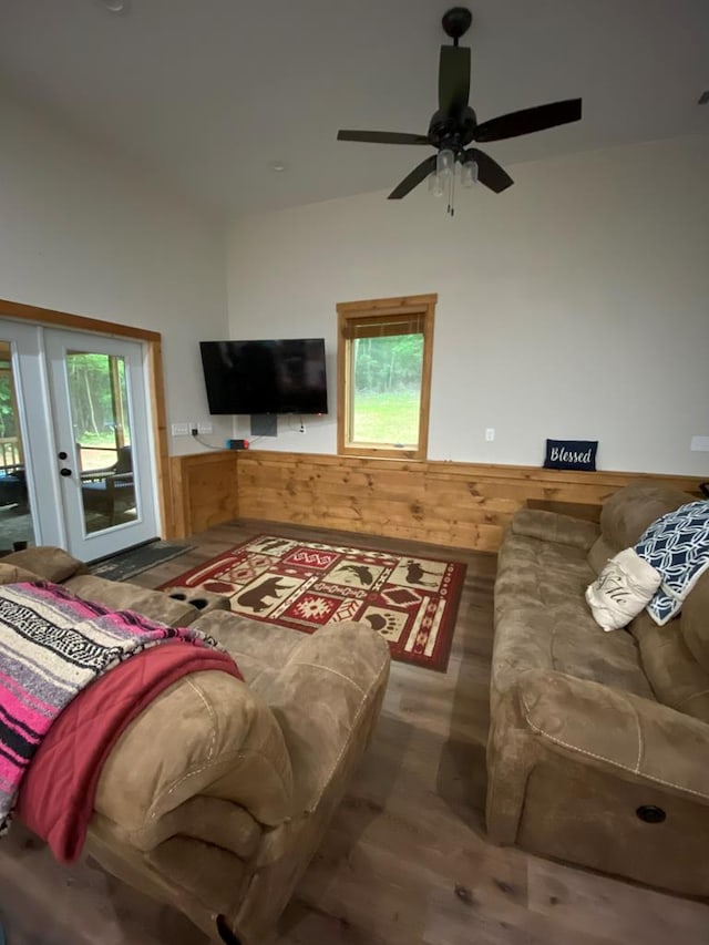 living room featuring hardwood / wood-style flooring, plenty of natural light, and ceiling fan