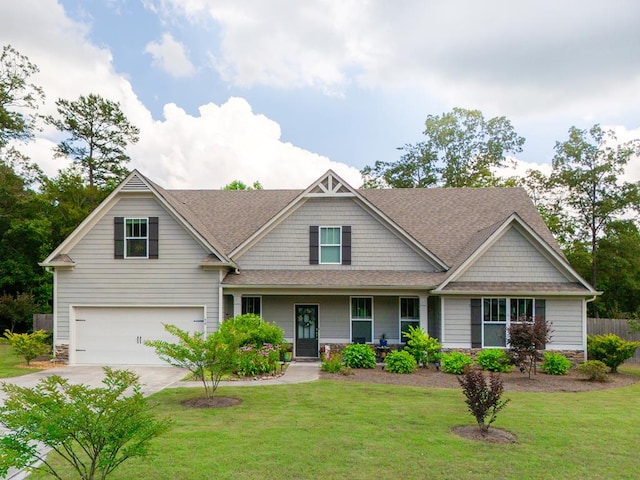 56 Highland Pointe Dr, Ellijay, GA 30536 - craftsman house with an attached garage, driveway, stone siding, roof with shingles, and a porch