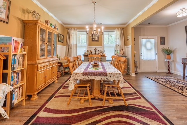 56 Highland Pointe Dr, Ellijay, GA 30536 - dining area featuring a chandelier, wood finished floors, ornamental molding, and wainscoting