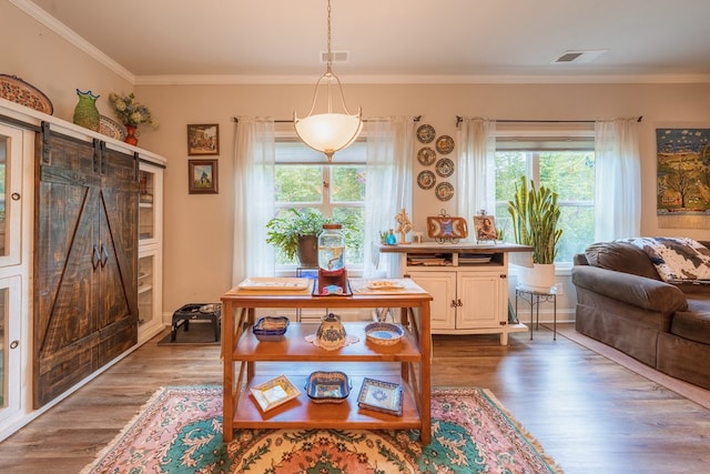 56 Highland Pointe Dr, Ellijay, GA 30536 - dining area featuring dark wood-type flooring, crown molding, and a barn door