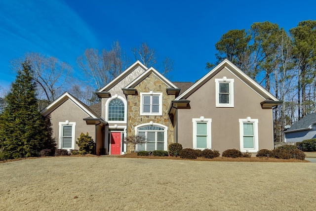 front facade featuring a front yard