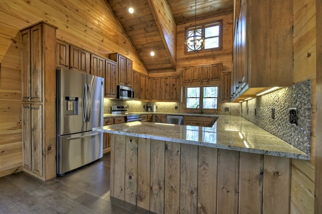 kitchen with a peninsula, brown cabinets, stainless steel appliances, tasteful backsplash, and a sink