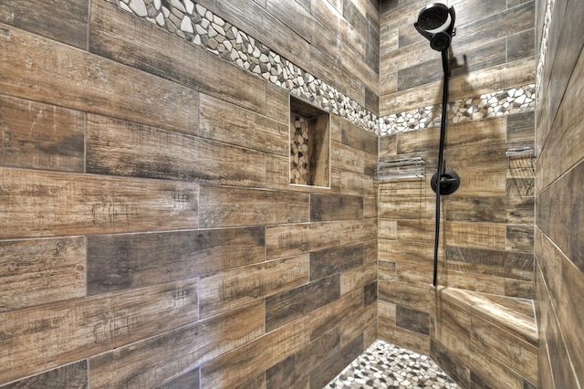 bathroom featuring tiled shower