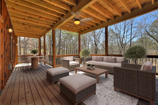 wooden terrace featuring an outdoor living space