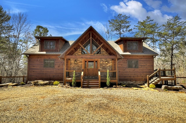 view of front of property featuring roof with shingles