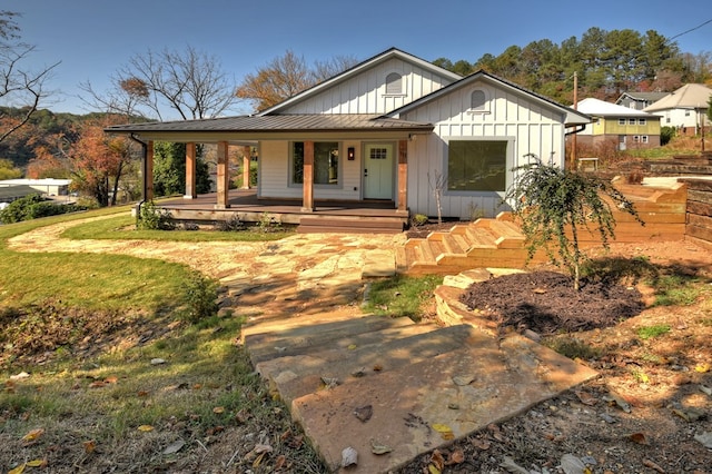 back of house featuring covered porch