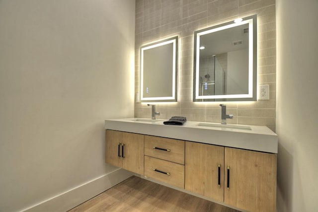 bathroom with vanity and wood-type flooring