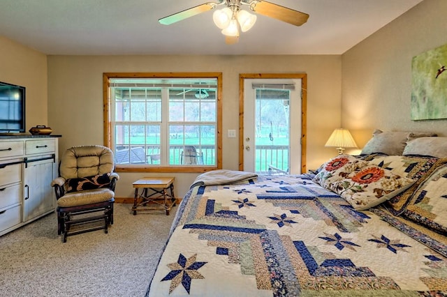 carpeted bedroom with access to outside and ceiling fan