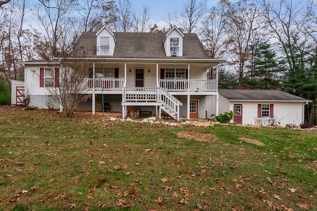 cape cod home featuring a front lawn and a porch