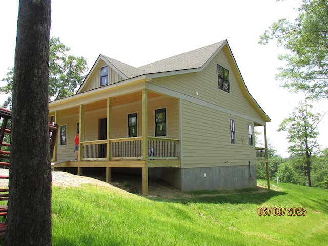 12 Shelton Springs S/D, Hayesville, NC 28904 - view of side of property with a porch, a lawn, board and batten siding, and a shingled roof