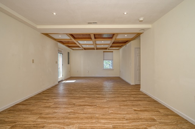 spare room with baseboards, recessed lighting, beamed ceiling, coffered ceiling, and light wood finished floors
