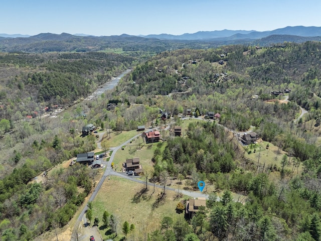 bird's eye view featuring a view of trees and a mountain view