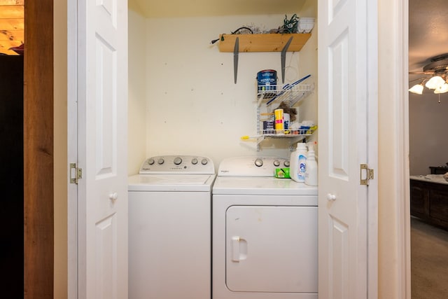 clothes washing area with separate washer and dryer