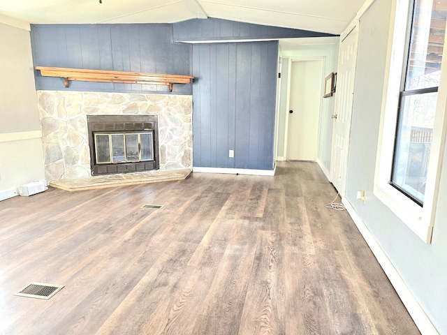 646 Snowy River Pl, Clarkesville, GA 30523 - unfurnished living room with wood finished floors, lofted ceiling, a fireplace, and wood walls