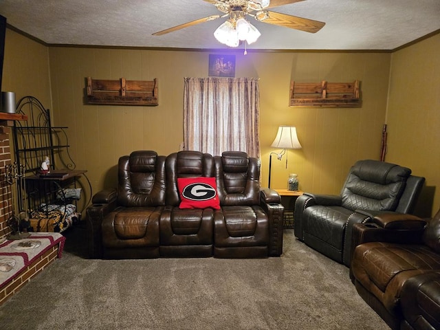 living area featuring carpet flooring, a textured ceiling, ceiling fan, and crown molding
