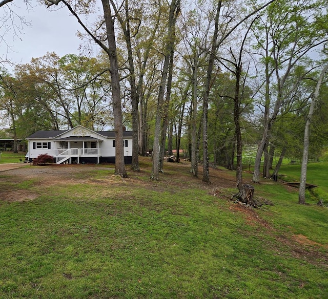 view of yard with covered porch