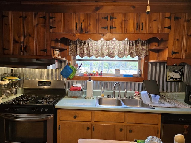 kitchen with under cabinet range hood, light countertops, dishwashing machine, a sink, and gas stove