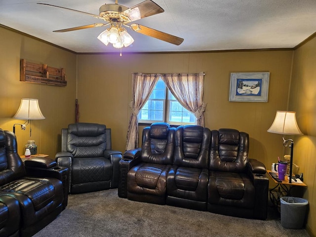 living area with carpet floors, crown molding, and a ceiling fan