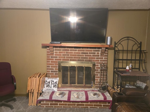 details with a fireplace, wooden walls, carpet, and a textured ceiling