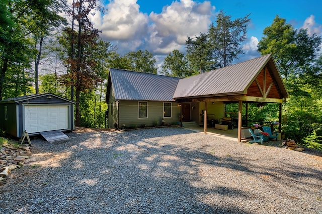 view of front facade featuring an outbuilding and a garage