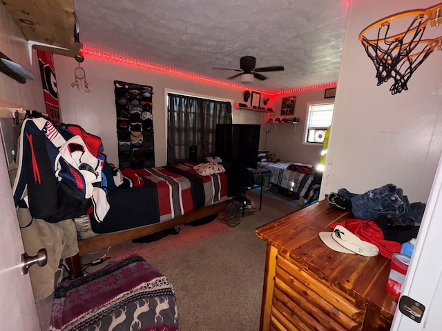 bedroom with carpet floors and a textured ceiling