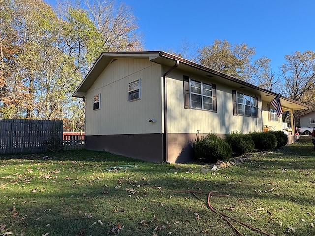 view of property exterior featuring a lawn