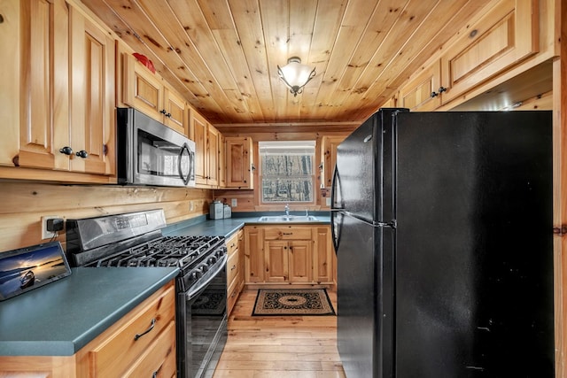 kitchen with light hardwood / wood-style flooring, black appliances, wooden ceiling, light brown cabinetry, and sink