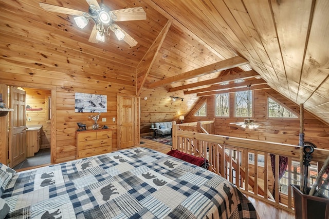 bedroom featuring vaulted ceiling with beams, light hardwood / wood-style floors, and wood ceiling