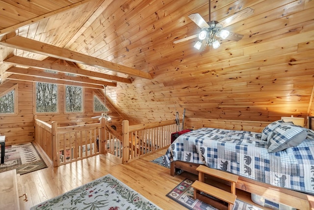 bedroom featuring wood ceiling, lofted ceiling with beams, and light wood-type flooring