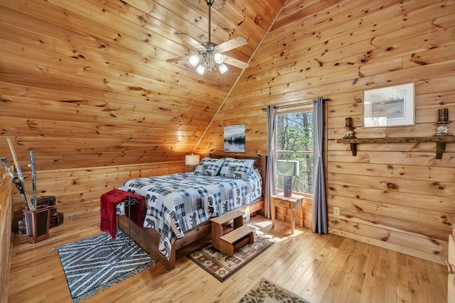 bedroom with vaulted ceiling, light hardwood / wood-style flooring, ceiling fan, and wooden ceiling