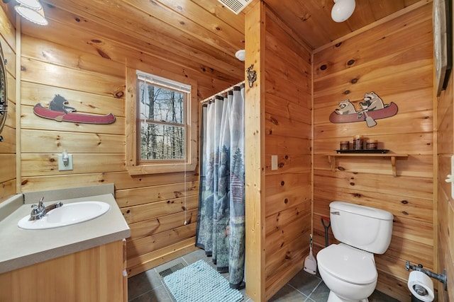 bathroom with wooden ceiling, large vanity, toilet, and tile flooring