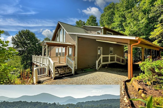 view of home's exterior featuring log veneer siding, an attached carport, driveway, and metal roof