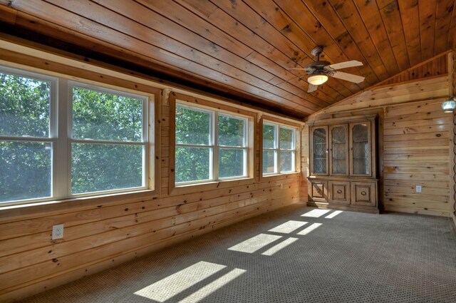 unfurnished sunroom featuring lofted ceiling, ceiling fan, and wooden ceiling