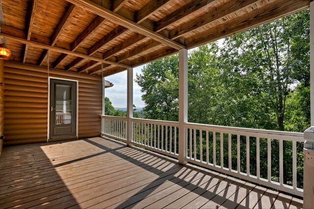 interior space featuring ceiling fan, wood ceiling, and a wealth of natural light