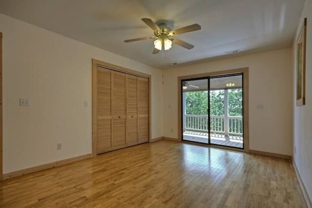 unfurnished bedroom with light wood finished floors, visible vents, ceiling fan, baseboards, and access to outside