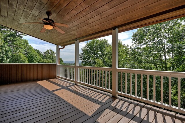 unfurnished bedroom featuring ceiling fan, light wood-type flooring, and access to exterior