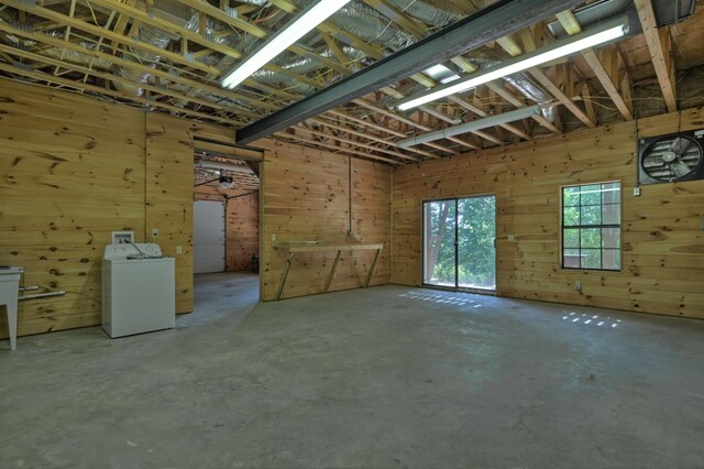 interior space with washer / clothes dryer and unfinished concrete flooring