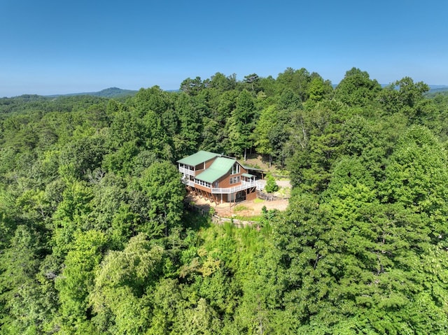 bird's eye view featuring a wooded view
