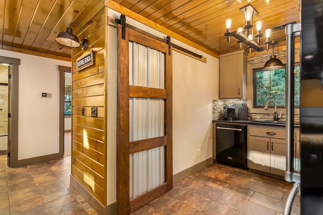 kitchen featuring a sink, black dishwasher, dark countertops, a barn door, and wooden ceiling