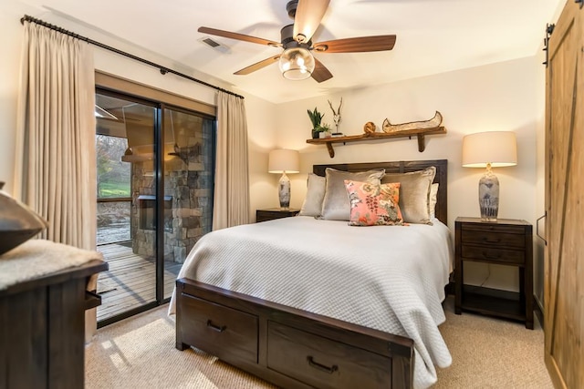 bedroom with access to exterior, visible vents, light colored carpet, and a ceiling fan