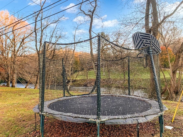 view of yard with a trampoline